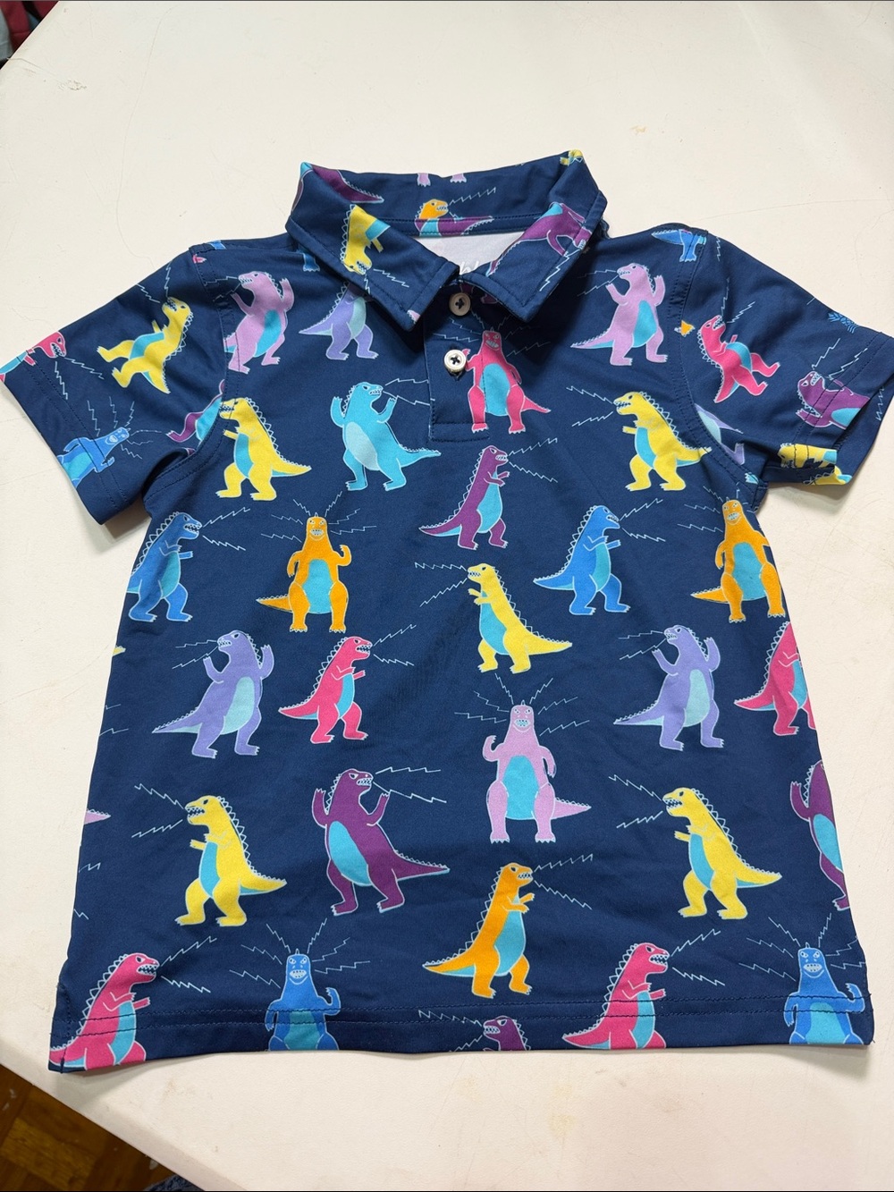 chubbies Navy Polo with Bright Multicolor Dinosaur Motif